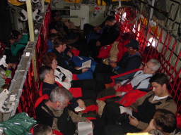 Passengers in the C-130, viewed from the top of the cargo palette (click to enlarge; 1.35 MB)