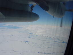 View of Antarctica through the C-130 window, the propellers stopped by the shutter (click to enlarge; 1.27 MB)