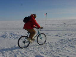 Paolo riding a bike at the South Pole (click to enlarge; 1.35 MB)